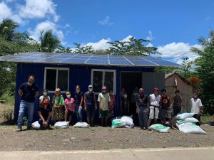 IP community with the sacks of fertilizer donated by TESDA, with the AGAK center in the background. The Ata Manobo tribe of Igang is led by Datu Manuel Mampaundag.